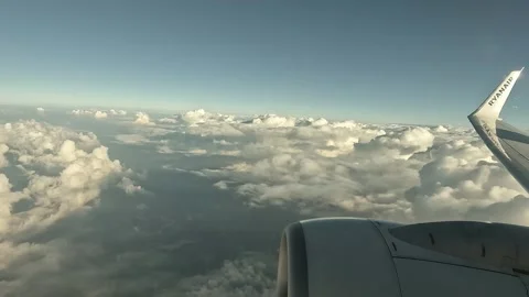 Aerial view through the window of an airplane with a propeller Stock Footage 315334686