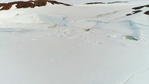 Aerial view. Thrown broken plane lies in the snow. Antarctica Stock Footage 119564397