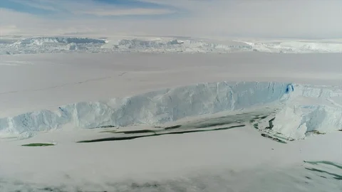 Aerial view. Thrown broken plane lies in the snow. Antarctica Stock Footage 119564443