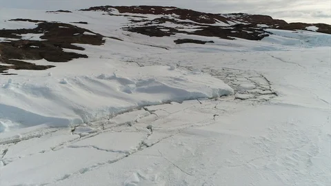 Aerial view. Thrown broken plane lies in the snow. Antarctica Stock Footage 119564569