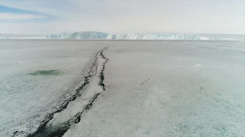 Aerial view. Thrown broken plane lies in the snow. Antarctica Stock Footage 119564738