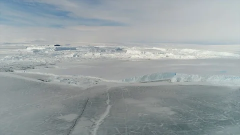 Aerial view. Thrown broken plane lies in the snow. Antarctica Stock Footage 119565796