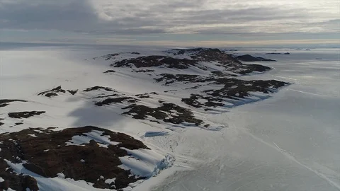 Aerial view. Thrown broken plane lies in the snow. Antarctica Stock Footage 119566417