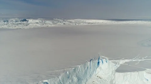 Aerial view. Thrown broken plane lies in the snow. Antarctica Stock Footage 119566574