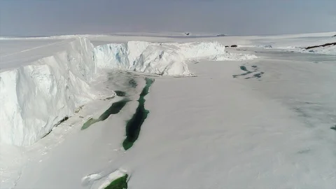 Aerial view. Thrown broken plane lies in the snow. Antarctica Stock Footage 119567037
