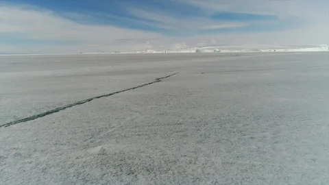Aerial view. Thrown broken plane lies in the snow. Antarctica Stock Footage 119567152