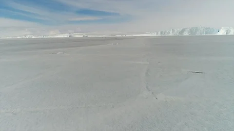 Aerial view. Thrown broken plane lies in the snow. Antarctica Stock Footage 119567233