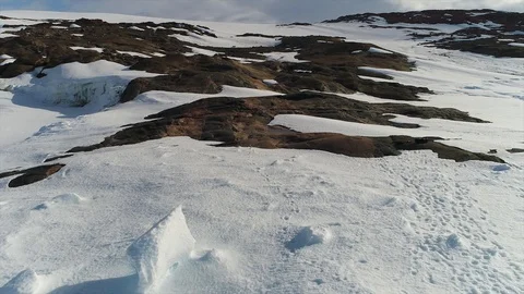 Aerial view. Thrown broken plane lies in the snow. Antarctica Stock Footage 119567366