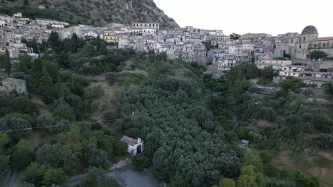 An aerial view of a tightrope walker walking above a deep valley. Video stock 342394114