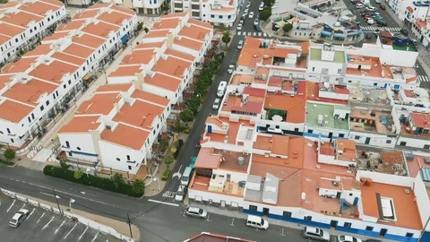 Aerial view. Tiled roofs of white resort houses off the coast of the Atlantic Video stock 112354343