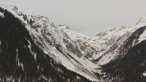 Aerial view with a tilt down forward of alps Stock Footage 125141127