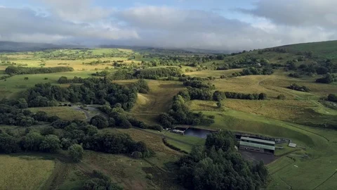 Aerial view, tilt down move. Drone panorama of green plains near Llyn Celyn w Stock Footage 94228227