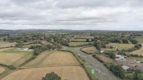 Aerial view, tilt down move. Busy roundabout from distance,near Tarvin, small Stock Footage 95562583