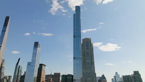 Aerial view tilting away from the Central park tower, sunny day in New Stock-Footage 279968136