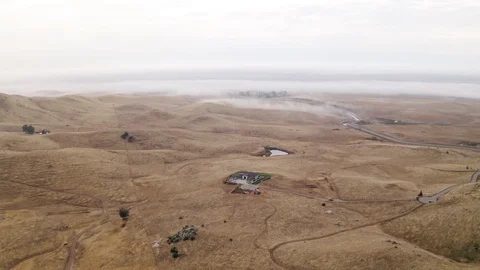 Aerial View Tilting Down to Large House in Hills and Mountain Landscape Stock-Footage 123443250