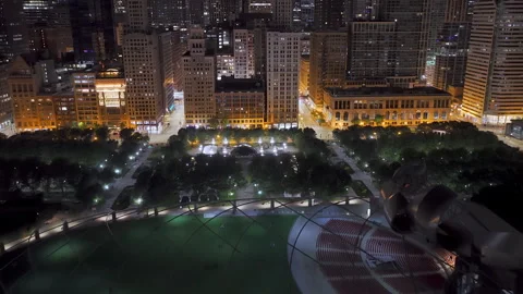 Aerial view tilting toward the Bean, Cloud Gate, night in Millennium Park Stock Footage 325327951