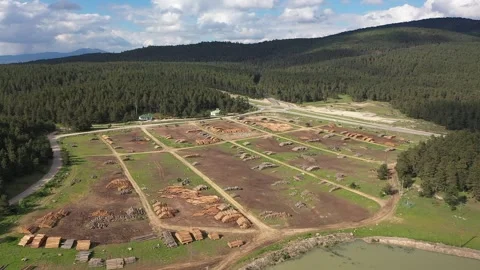 Aerial view of timber for processing at sawmill plant for wood production al Stock Footage 294078851