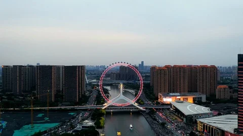 Aerial view of time lapse of the Ferris wheel in downtown Tianjin Stock Footage 107479835