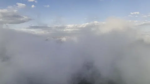 Aerial view timelapse of parallax clouds over a mountainous area. Videos summer Stock Footage 245628952