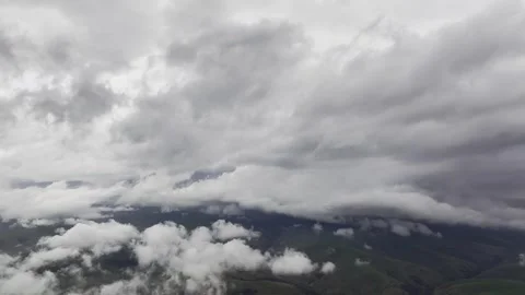 Aerial view timelapse of parallax clouds over a mountainous area. Videos summer Stock Footage 262467481