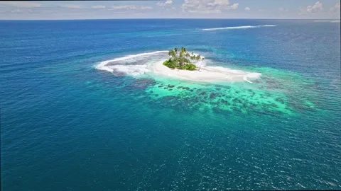 Aerial view of tiny paradise island in the middle of ocean. Stock Footage 167429915