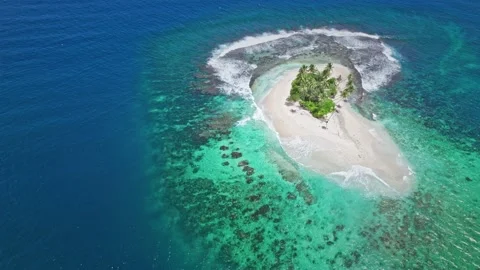 Aerial view of tiny paradise island in the middle of ocean. Stock Footage 167429970