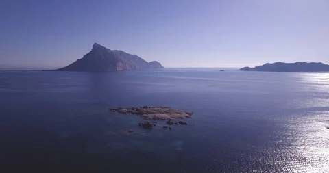 Aerial, a view on a tiny stone island in the middle of Mediterranean sea in S 스톡 동영상 104244968