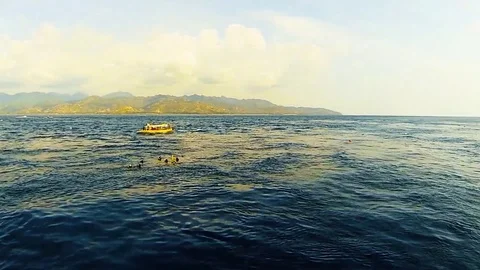 Aerial view of a tiny tropical islands, with boat Stock Footage 78074680