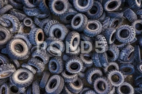 Aerial view of tire landfill. Environmental disaster. Stock Photos