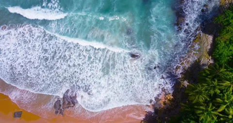 Aerial view Top-down Beach sand and seawater wave in sunset time. Stock Footage 233755342
