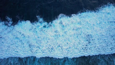 Aerial view Top down big sea waves deep blue sea at evening. Calm tranquil waves Stock Footage 256456901