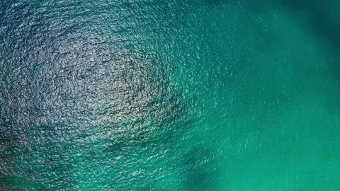 Aerial view top-down of blue water surface Stock Footage 173040568