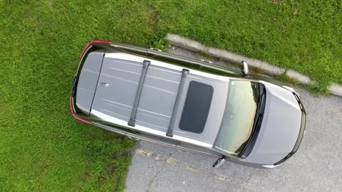 Aerial view Top down Drone shot Flying Above parked grey car in the green park Stock Footage 172507284