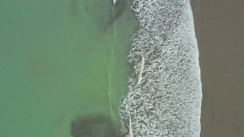 Aerial view, top down of the Pacific ocean with a green coloration Stock Footage 146344961