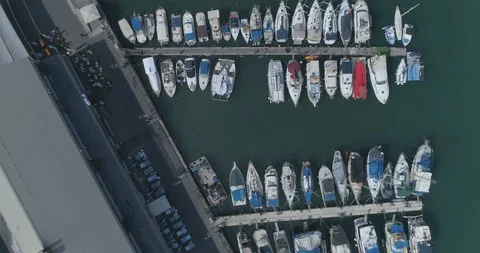 Aerial view top down shot above port marina bay with Boats And Yachts Parking or Video stock 128254180