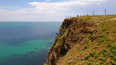 Aerial view of top down view of the red rocky coastline Stock Footage 109249475