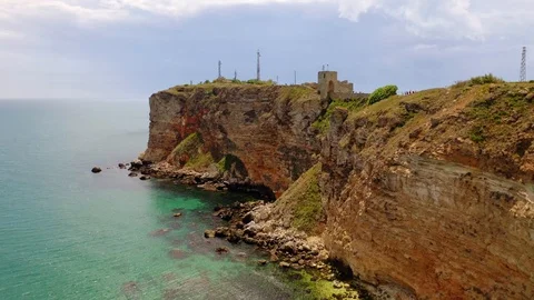 Aerial view of top down view of the red rocky coastline Vídeo Stock 109249493
