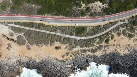 Aerial view top down view of of a straight road and rugged coastline at Guincho Stock Footage 164608344