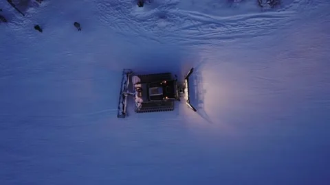 Aerial view: Top down view. Work out the preparation of the ski slope. Snowcatat Stockbeeldmateriaal 166388644