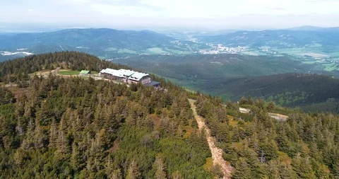 Aerial view of the top of mount Serak where is a tourist wooden cottage Stock Footage 129547354