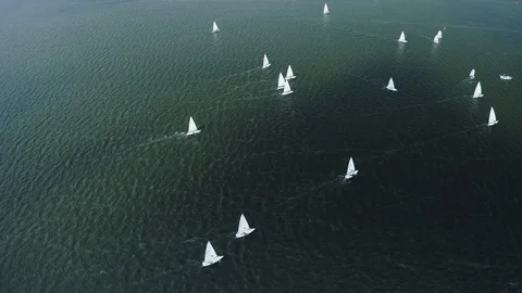 Aerial view top slide drone turn blue sea and small training sailing yachts Stock Footage 106375188