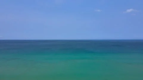 Aerial view top view beach sea sand sunny water wave blue sky background Stock Footage 151029986