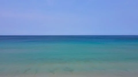 Aerial view top view beach sea sand sunny water wave blue sky background Stock Footage 151030338