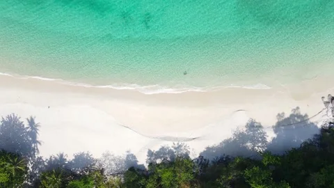 Aerial view top view beach and seawater sandy beach in summer nature and travel Stock Footage 153376830
