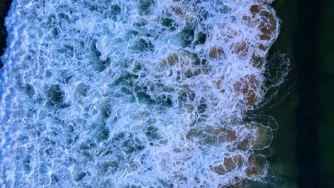 Aerial view top view beach sand crystal water wave in sea background summer Stock Footage 153379296