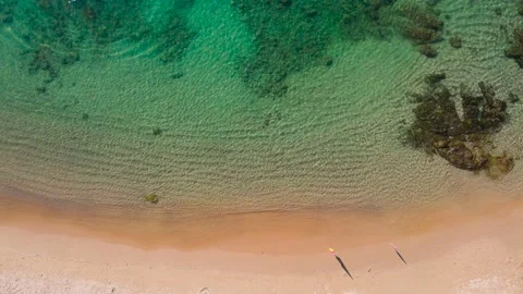 Aerial view top view beach sea sand sun crystal water wave sunny background Stock Footage 153381253