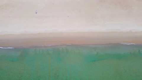 Aerial view top view beach sea sand sun water wave beautiful sunset background Stock Footage 153381849