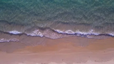 Aerial view top view beach sea sand sun water wave beautiful sunset background Stock Footage 153381892