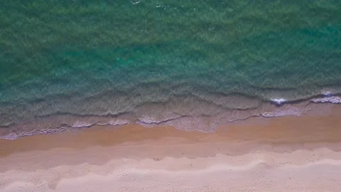 Aerial view top view beach sea sand sun water wave beautiful sunset background Stock Footage 153381906