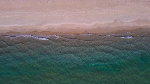 Aerial view top view beach sea sand sun water wave beautiful sunset background Stock Footage 153381940